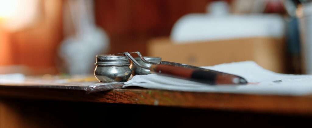 A vibrant image of art supplies on a wooden desk, showcasing creativity and inspiration