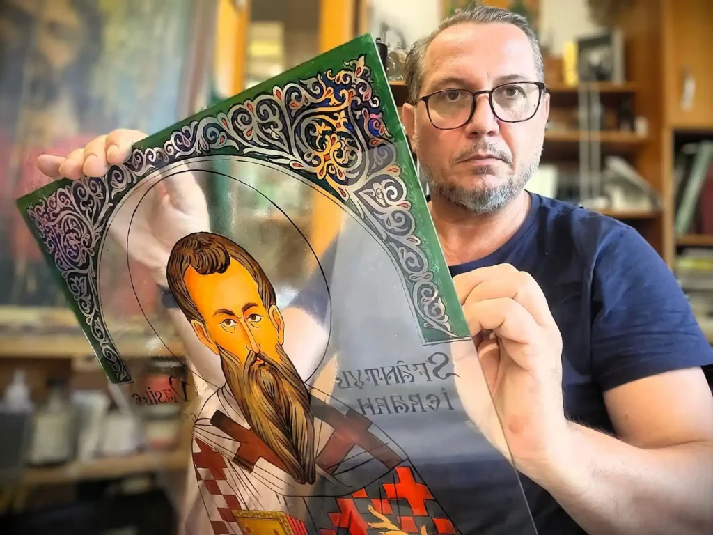 Icoană pe sticlă pictată manual, realizată în tehnică tradițională. Lucrare originală semnată de Călin Bogătean.